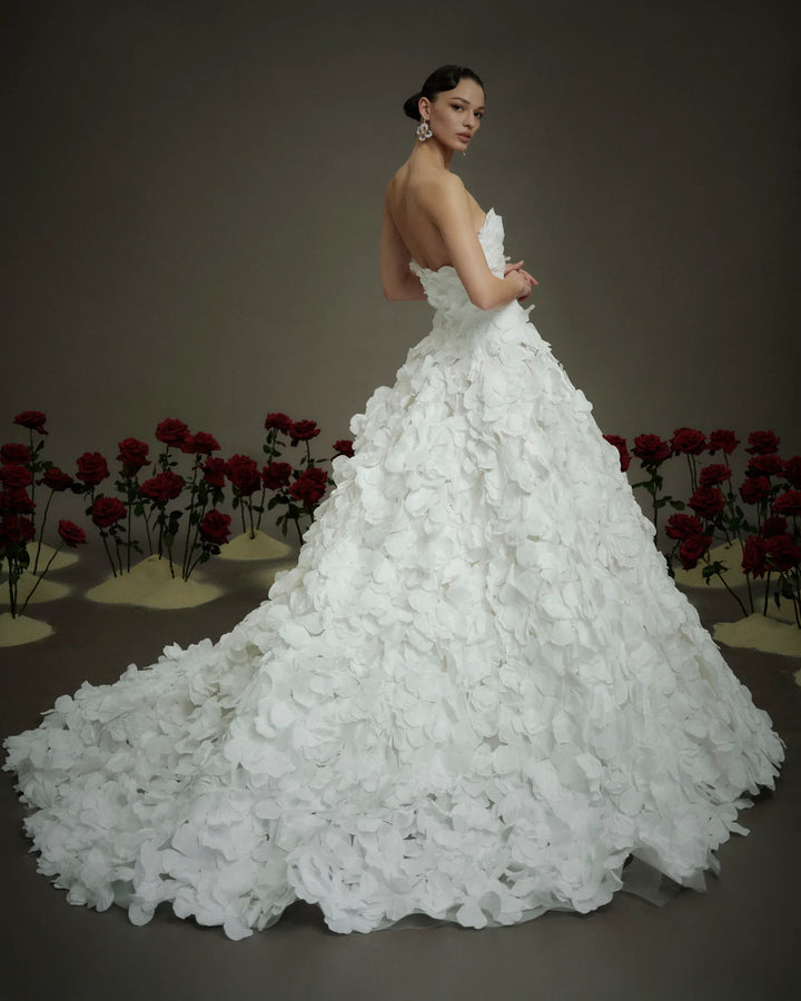 full back of nicole and felicia nf114 ivory organza ball gown with floral petals throughout