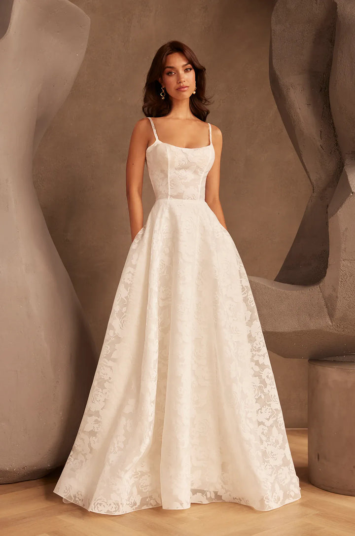 front of paloma blanca p5137 ivory burnout organza a-line wedding dress with a scoop neckline and thin straps