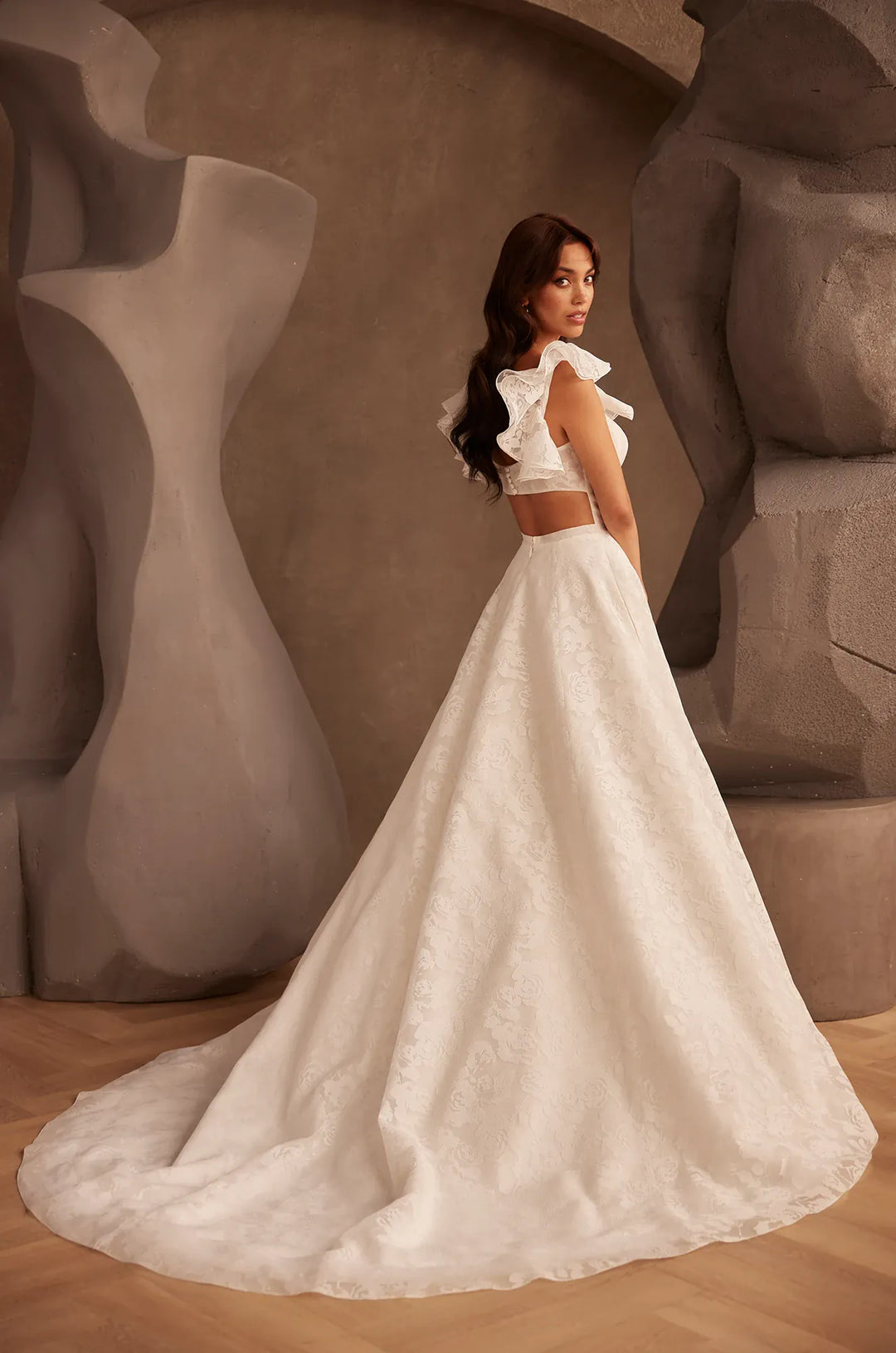 back of paloma blanca p5137 ivory burnout organza a-line wedding dress with an open back, shown with the matching ruffle straps
