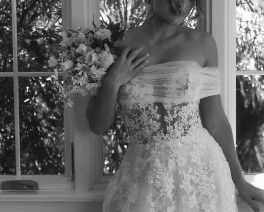 front of penelope by lex frannie ivory lace and tulle a-line wedding dress with a plunge bodice