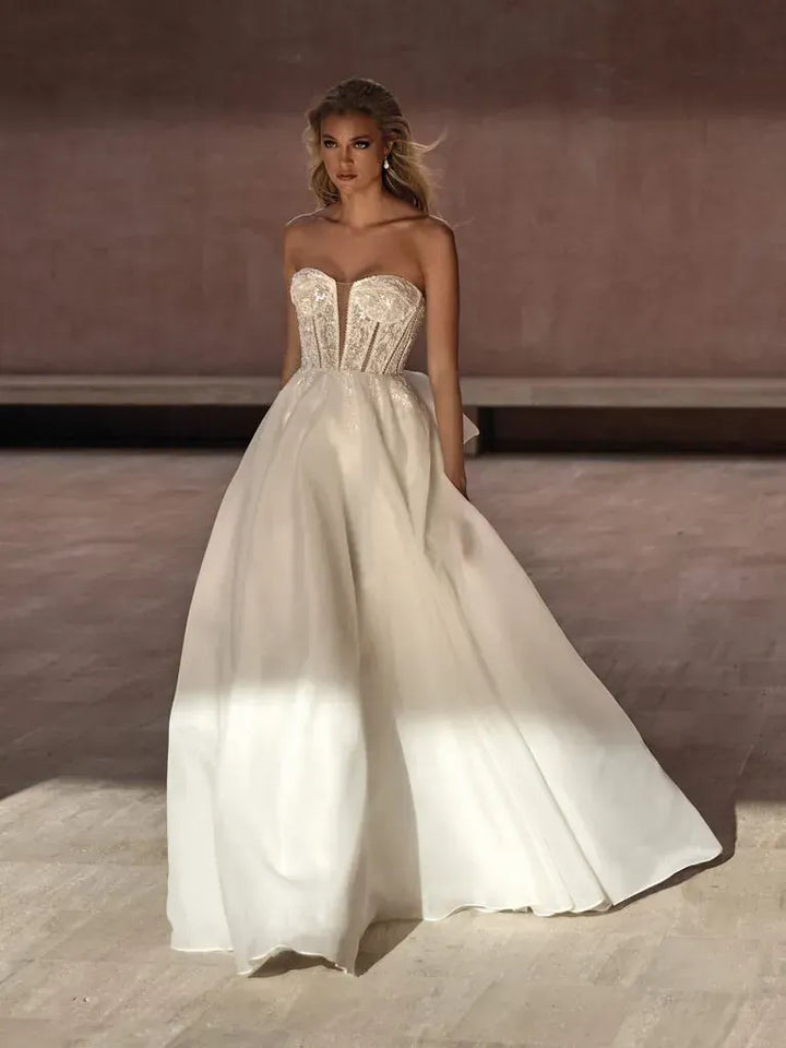 front of pronovias bayon ivory organza ball gown wedding dress with a strapless beaded bodice and plunge neckline