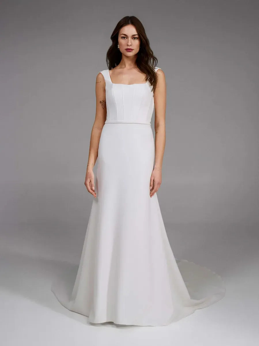 full front of pronovias holane ivory crepe fitted wedding dress featuring a square neckline with thick straps