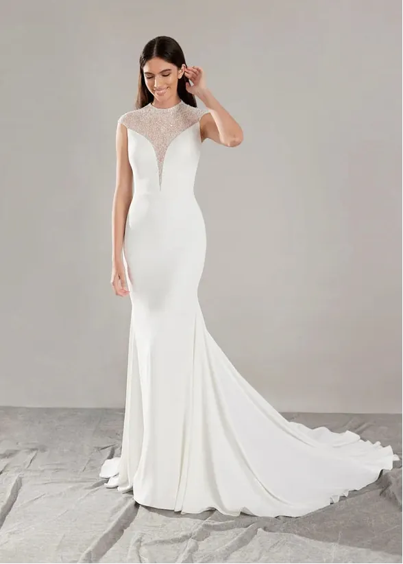 full front of pronovias honore ivory crepe fitted wedding dress with a beaded illusion neckline