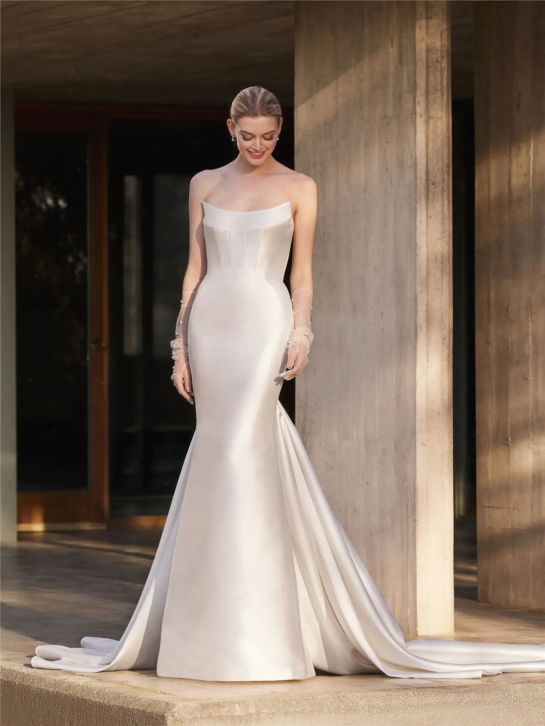 full front of pronovias magnolie ivory mikado fit n flare wedding dress with a scoop neckline and flared skirt
