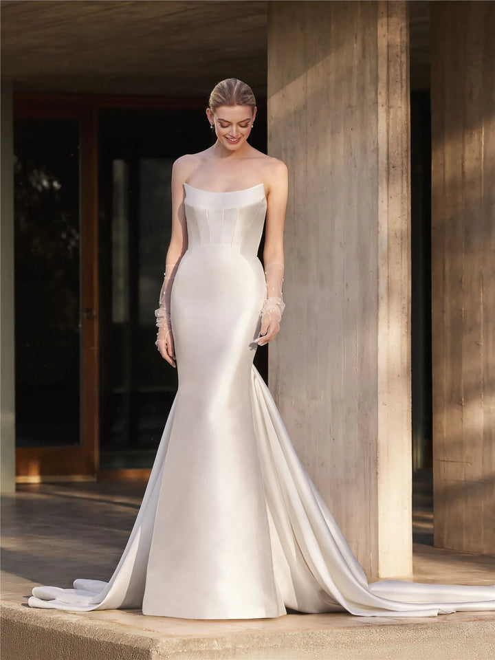 full front of pronovias magnolie ivory mikado fit n flare wedding dress with a scoop neckline and flared skirt