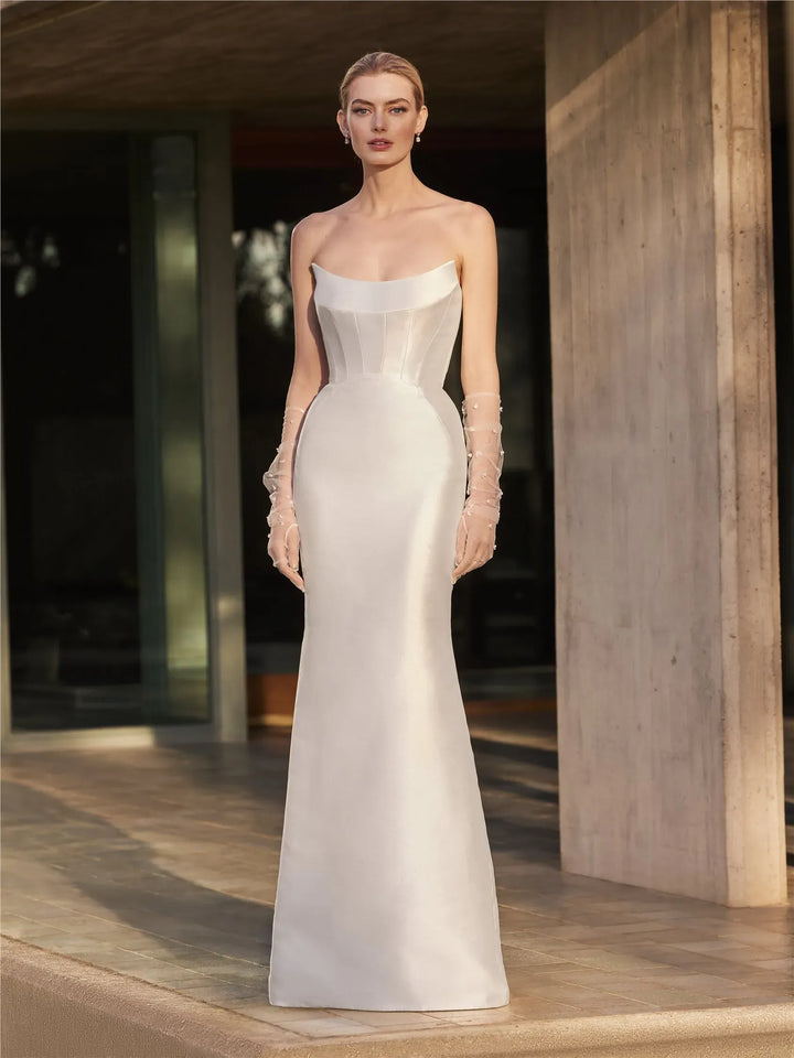 full front of pronovias magnolie ivory mikado fit n flare wedding dress with a scoop neckline and flared skirt