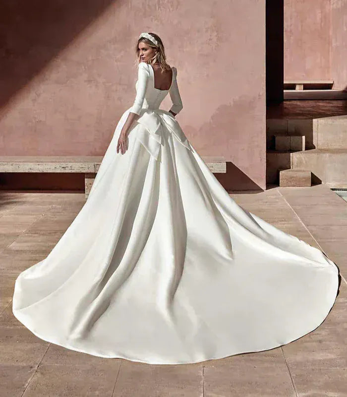 back of pronovias vellania ivory mikado ball gown wedding dress with a square back and long train