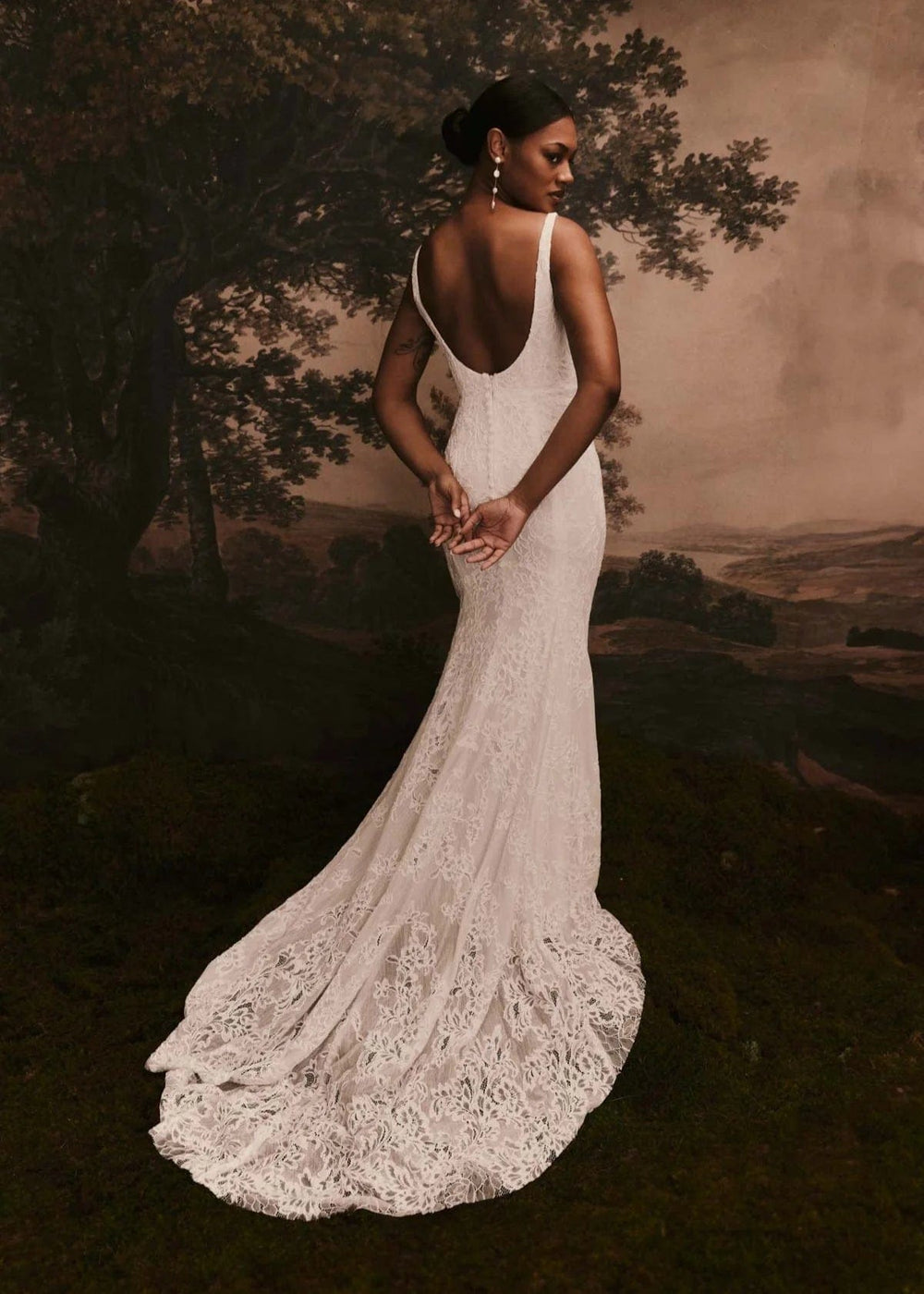 back of renhue esme ivory lace fitted wedding dress with open back and short lace train
