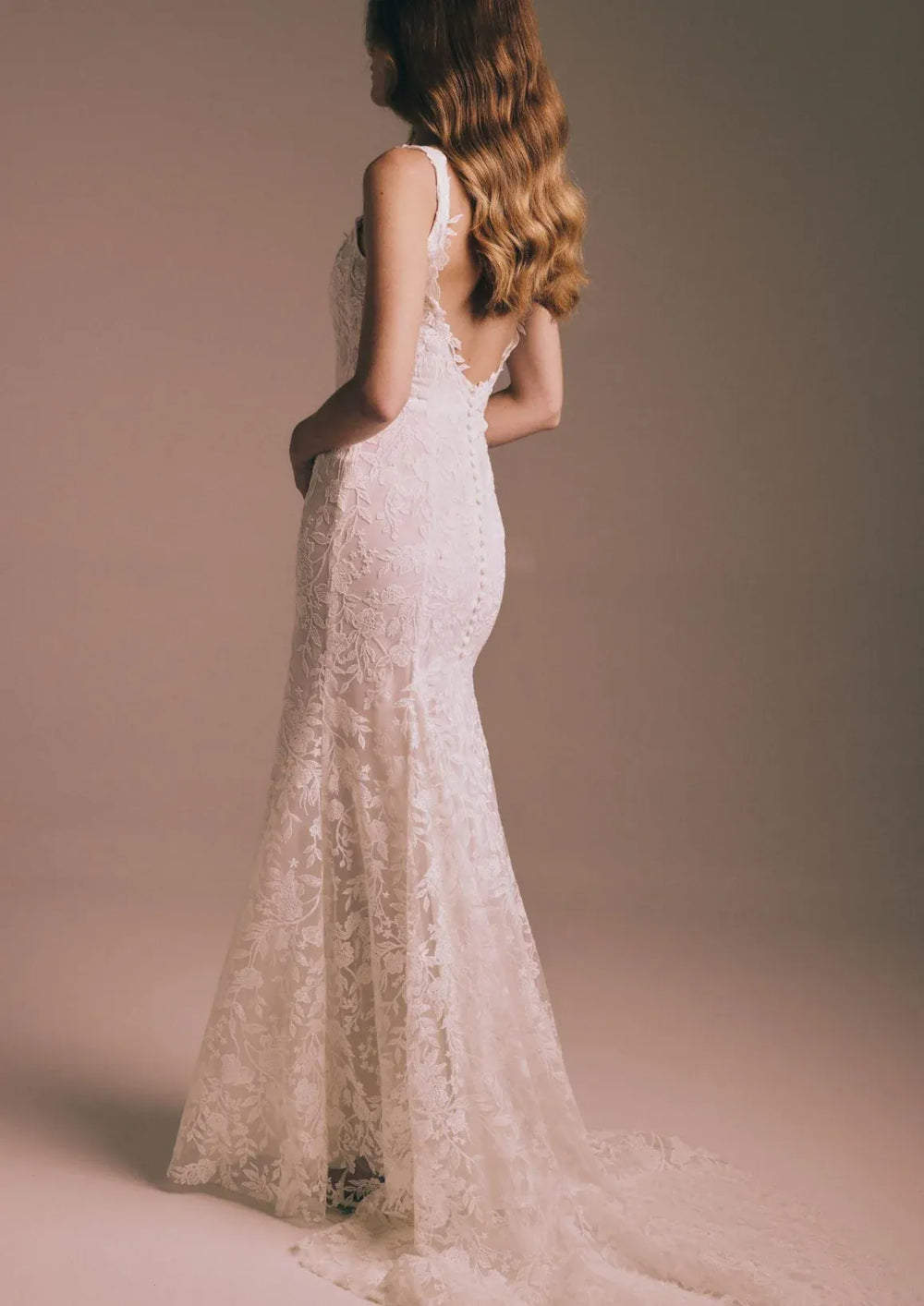 full back of renhue aster ivory lace fitted wedding dress with a short train