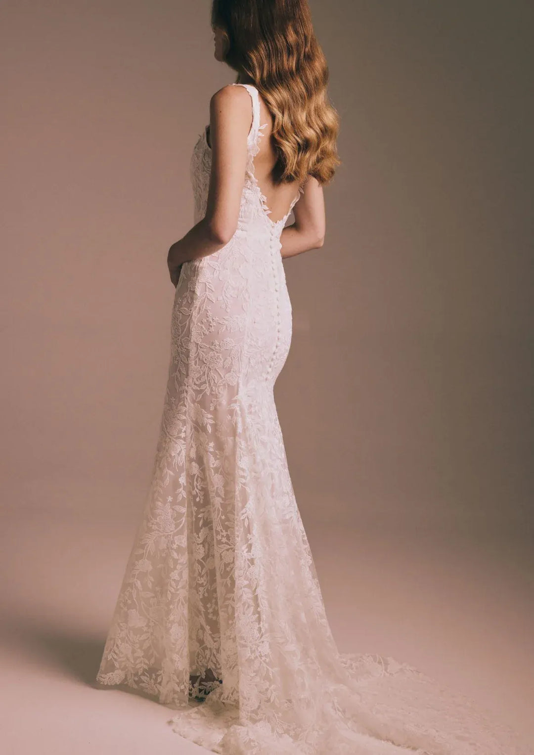 full back of renhue aster ivory lace fitted wedding dress with a short train