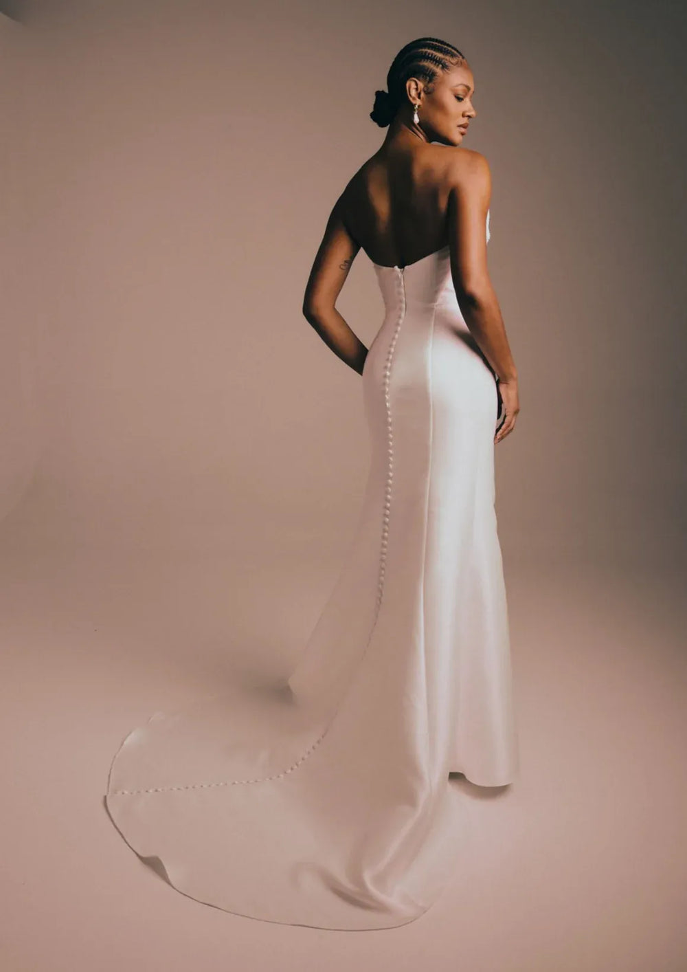 back of renhue celeste ivory mikado fit and flare wedding dress, showing the full back with overed buttons down the back of the skirt and train