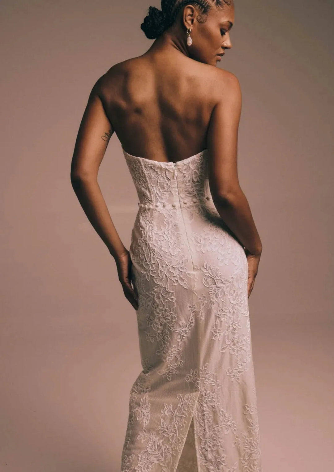 close up of renhue elara ivory lace fitted wedding dress showing the back of the gown