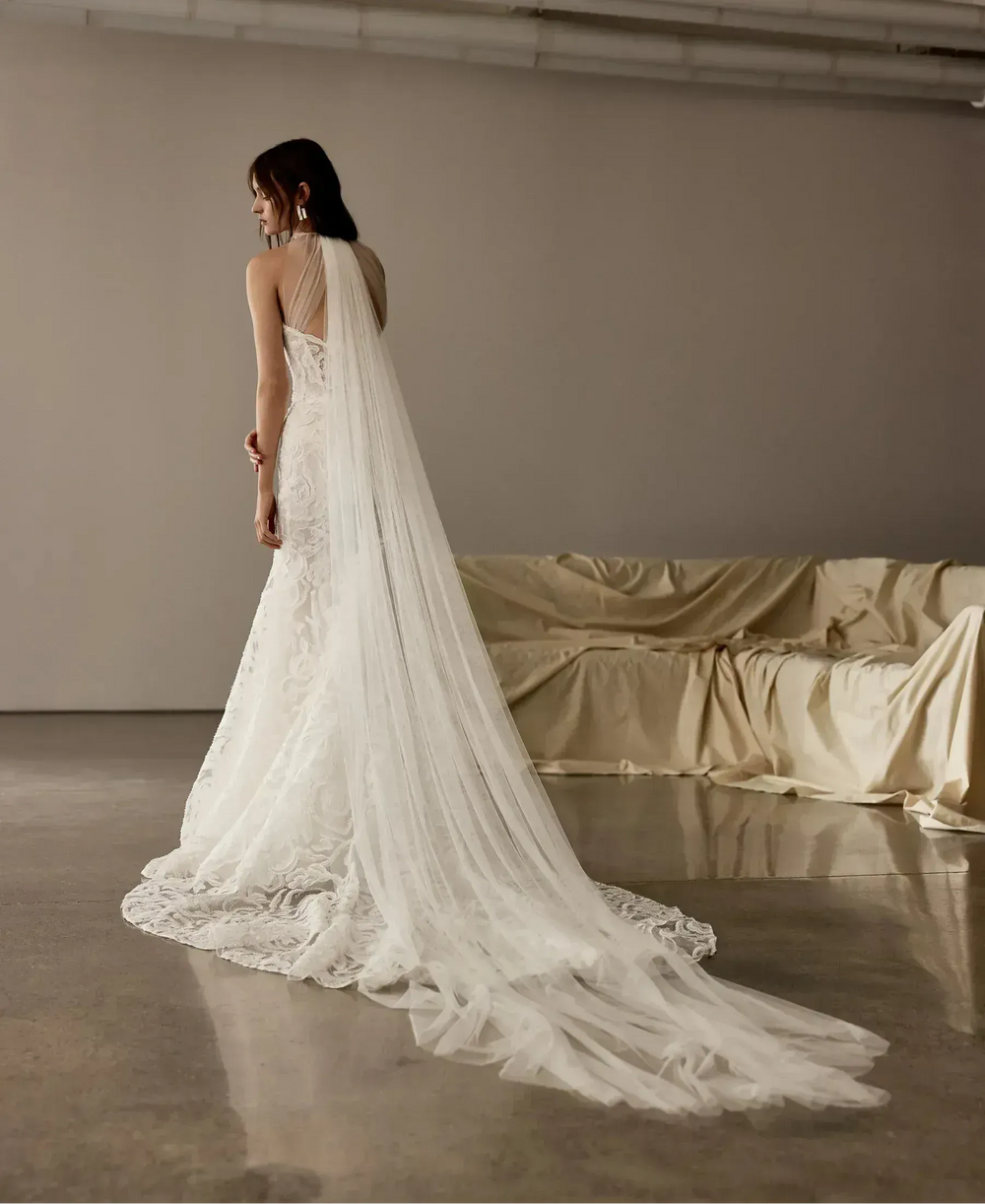 full back of rivini cameron ivory lace fitted wedding dress featuring a detachable tulle neckline that goes over the bodice for two different looks