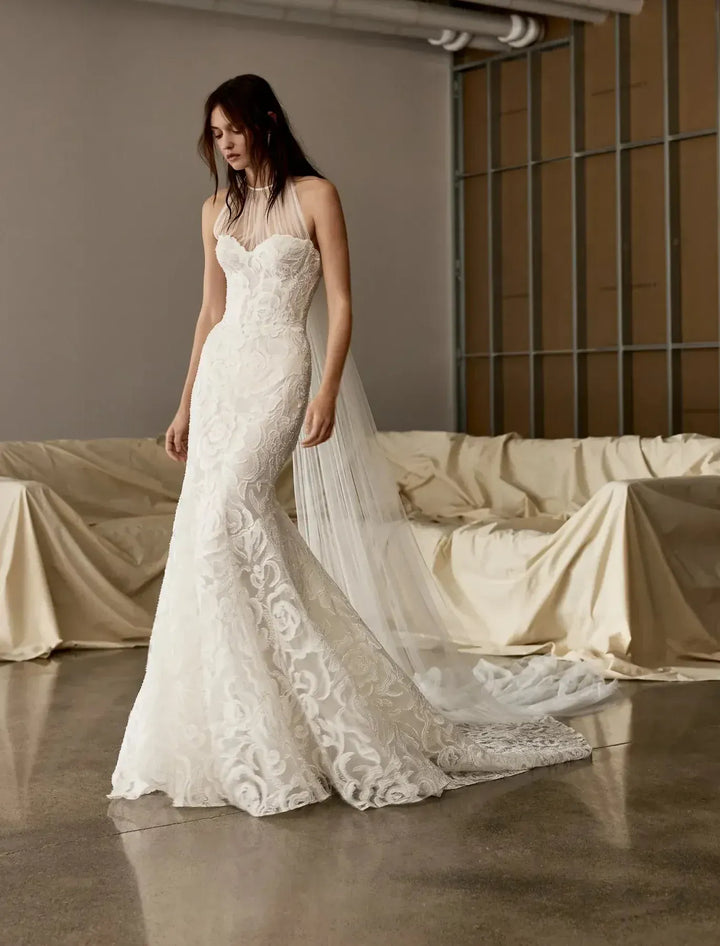 full front of rivini cameron ivory lace fitted wedding dress featuring a detachable tulle neckline that goes over the bodice for two different looks