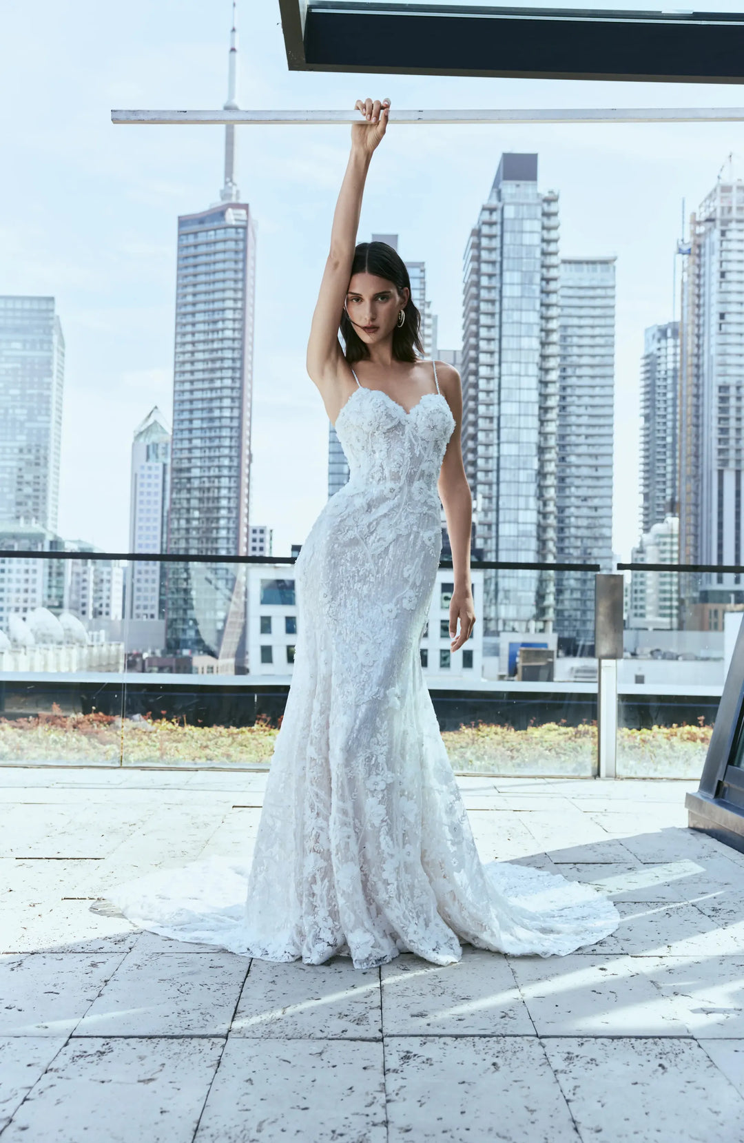 full front of rivini dove nude lace fitted wedding dress showing the sweetheart neckline, thin straps, and flowy skirt