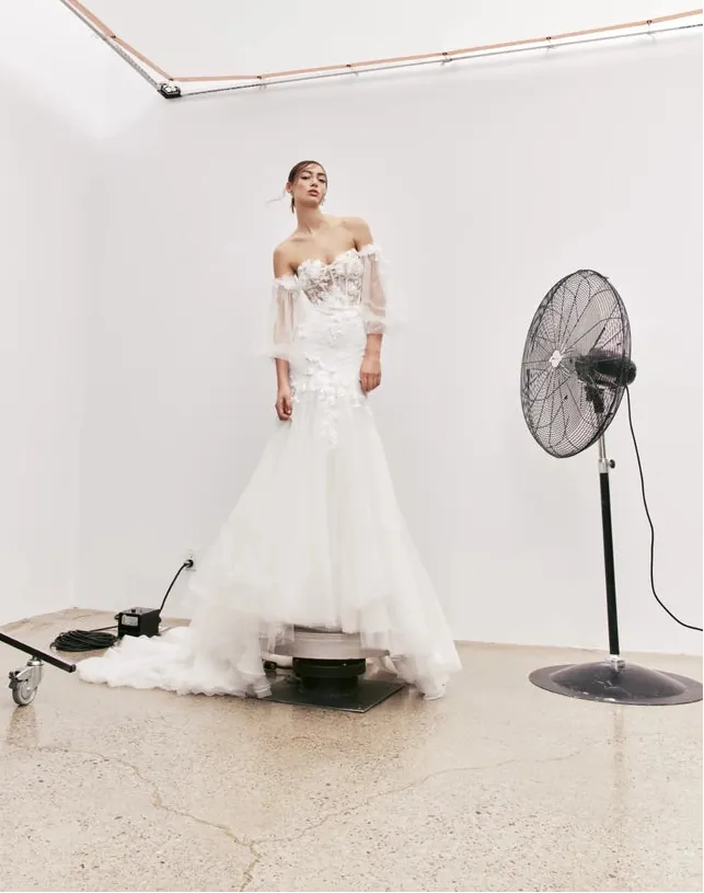 full front of rivini jax ivory lace fit and flare wedding dress featuring a strapless sweetheart neckline and flared skirt