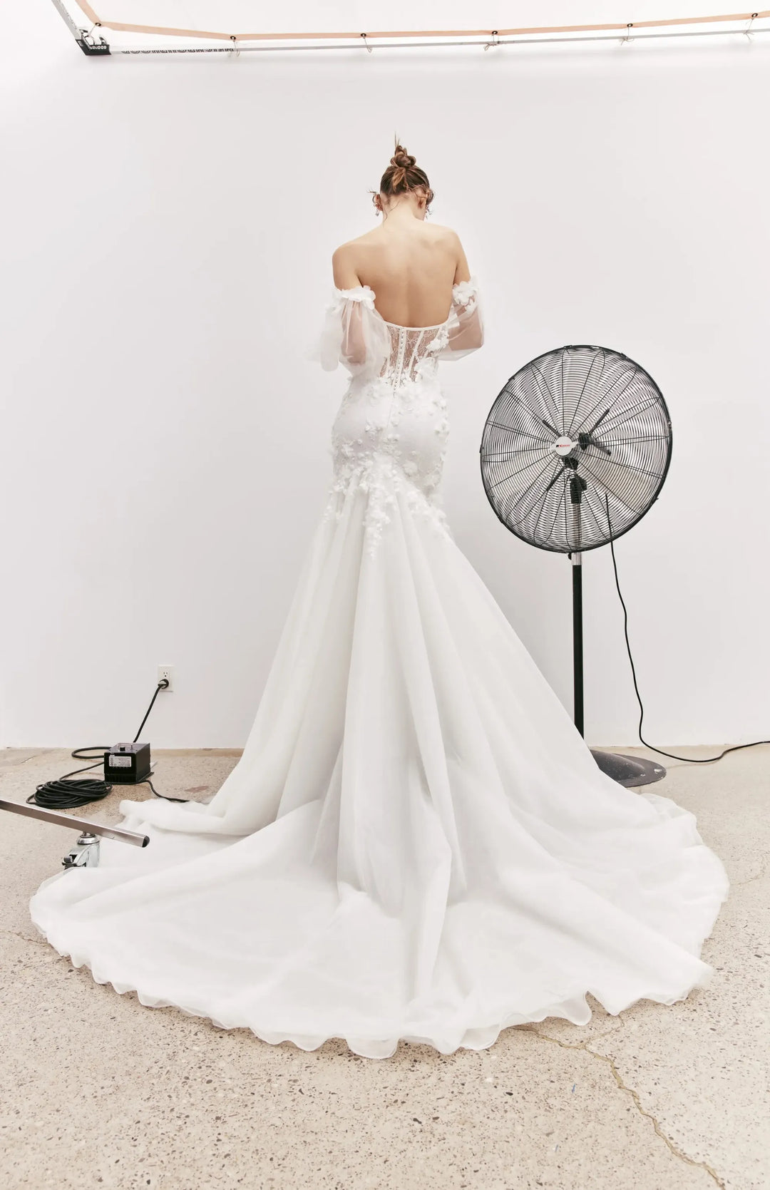 full back of rivini jax ivory lace fit and flare wedding dress featuring sheer back and chapel length train