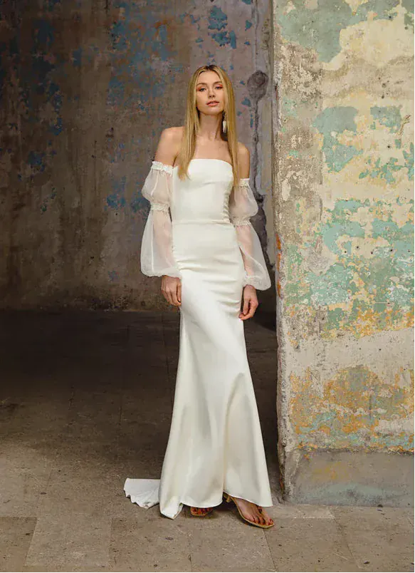 full front of scout bridal buttercup ivory crepe fitted wedding dress featuring a strapless straight neckline