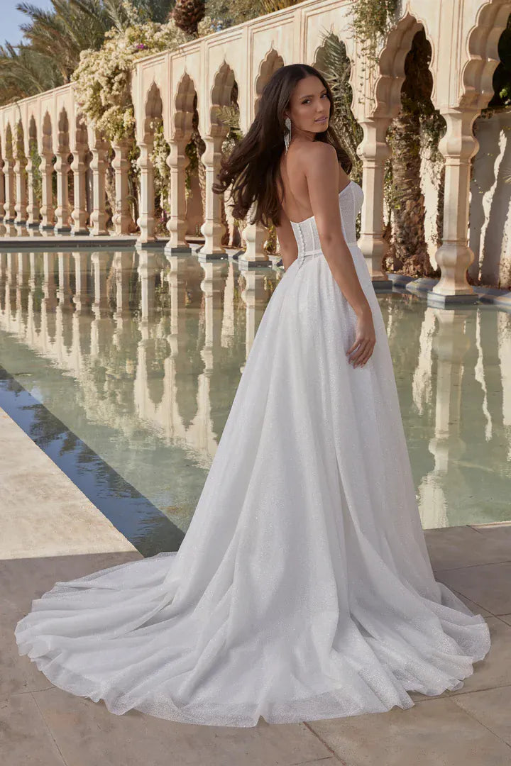 full back of sincerity bridal 44442 ivory glitter tulle a-line wedding dress featuring a v back accented with buttons, and a chapel length train