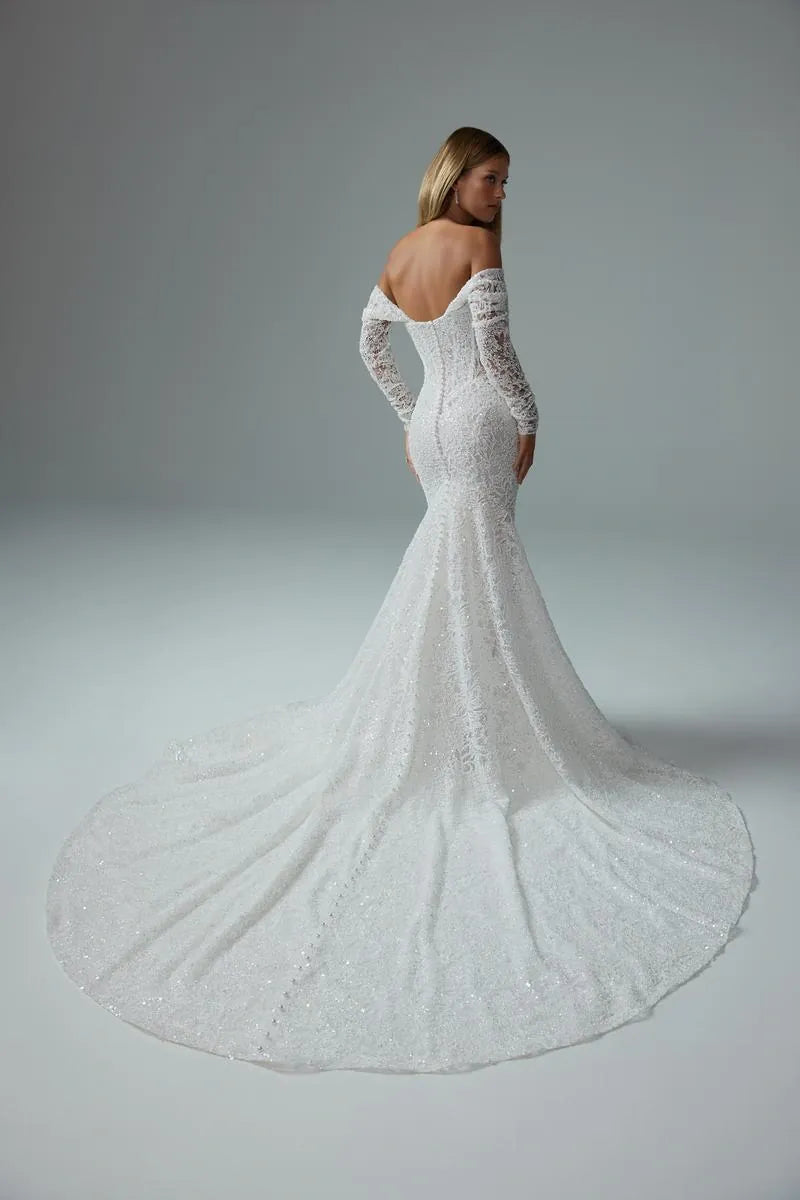 full back of sophia tolli premiere st661 ivory beaded lace fit and flare wedding dress featuring the off the shoulder long sleeves and a long circle train