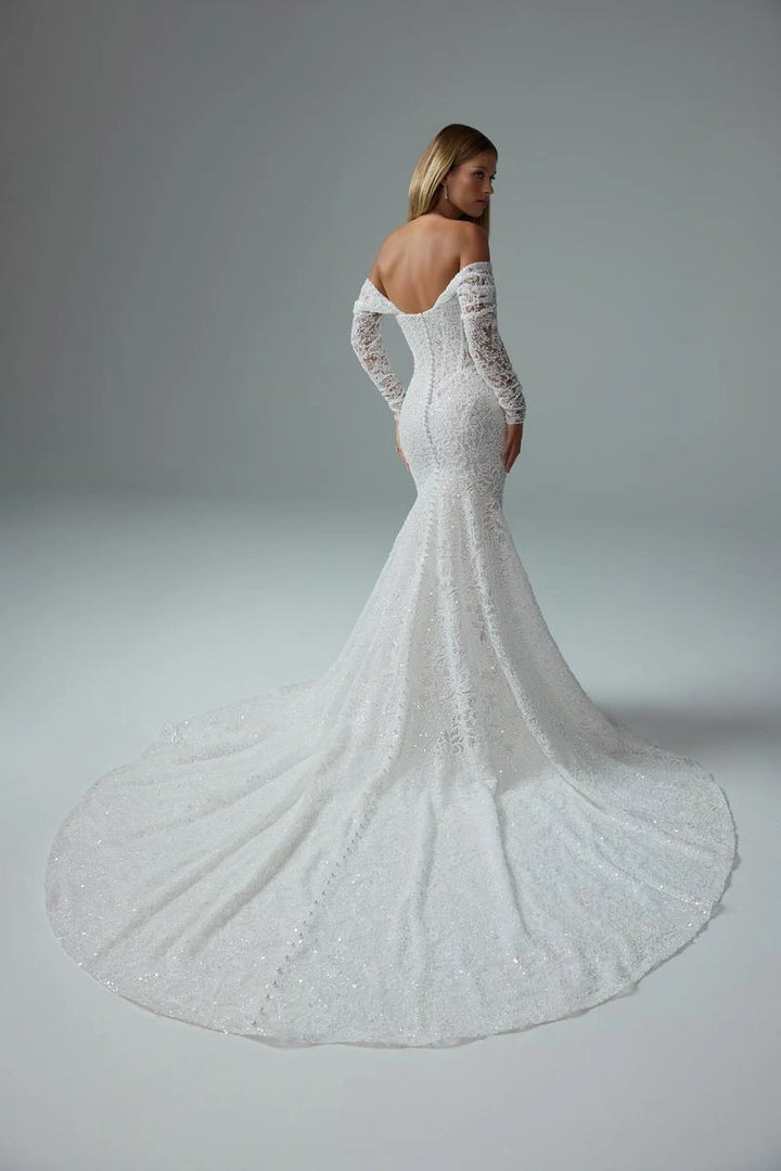 full back of sophia tolli premiere st661 ivory beaded lace fit and flare wedding dress featuring the off the shoulder long sleeves and a long circle train