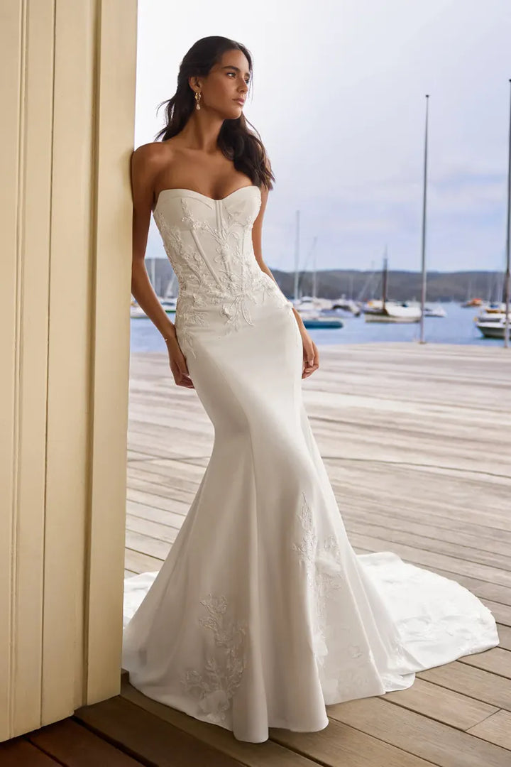 front of sophia tolli y3205 ivory crepe fit and flare wedding dress, showing the full front with sweetheart neckline and floral appliques