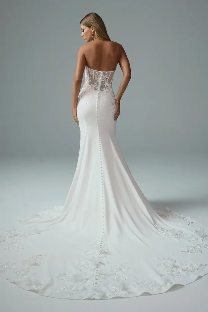 back of sophia tolli y3205 ivory crepe fit and flare wedding dress, showing the sheer back and chapel length train with floral details