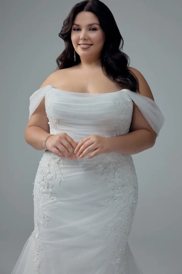 close up of sophia tolli y3212 ivory tulle fitted wedding dress showing the off the shoulder straps and fitted bodice with a scoop neckline