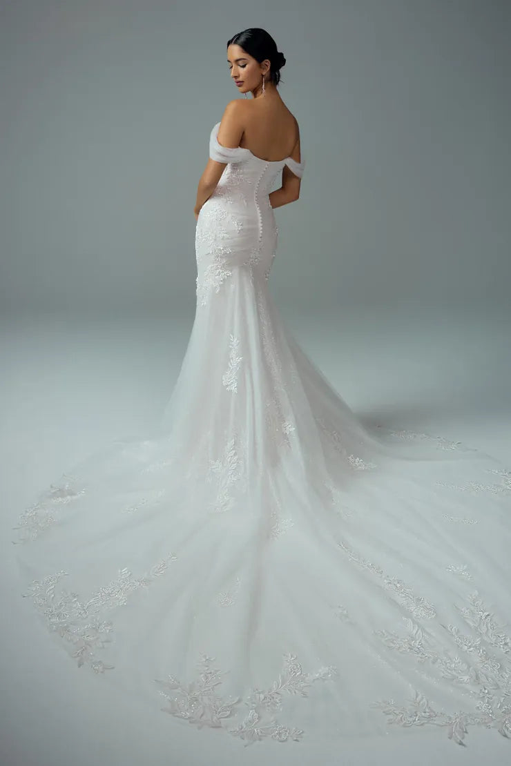 back of sophia tolli y3212 ivory tulle fitted wedding dress showing the full back, with the scattered lace appliques and long train trimmed with lace