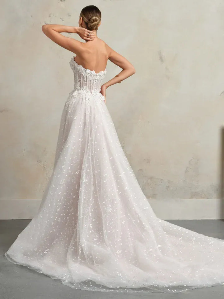 full back of sottero and midgley athlone blush tulle ball gown with a chapel length train