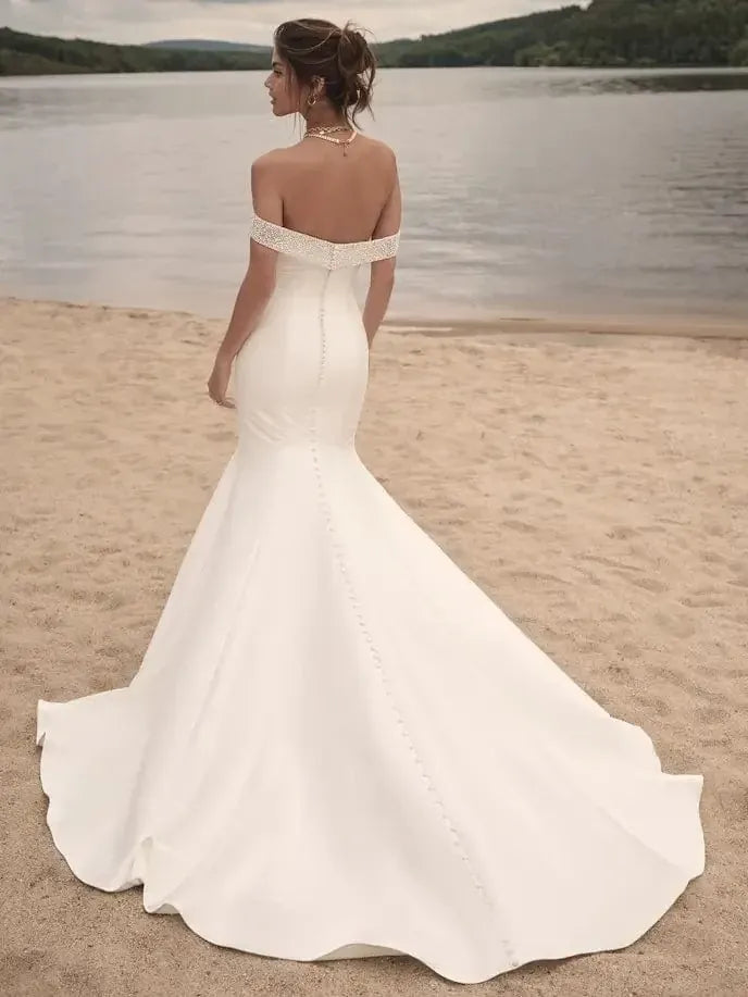 back of sottero and midgley fabienne ivory satin fitted wedding dress with beaded off the shoulder straps and chapel length train