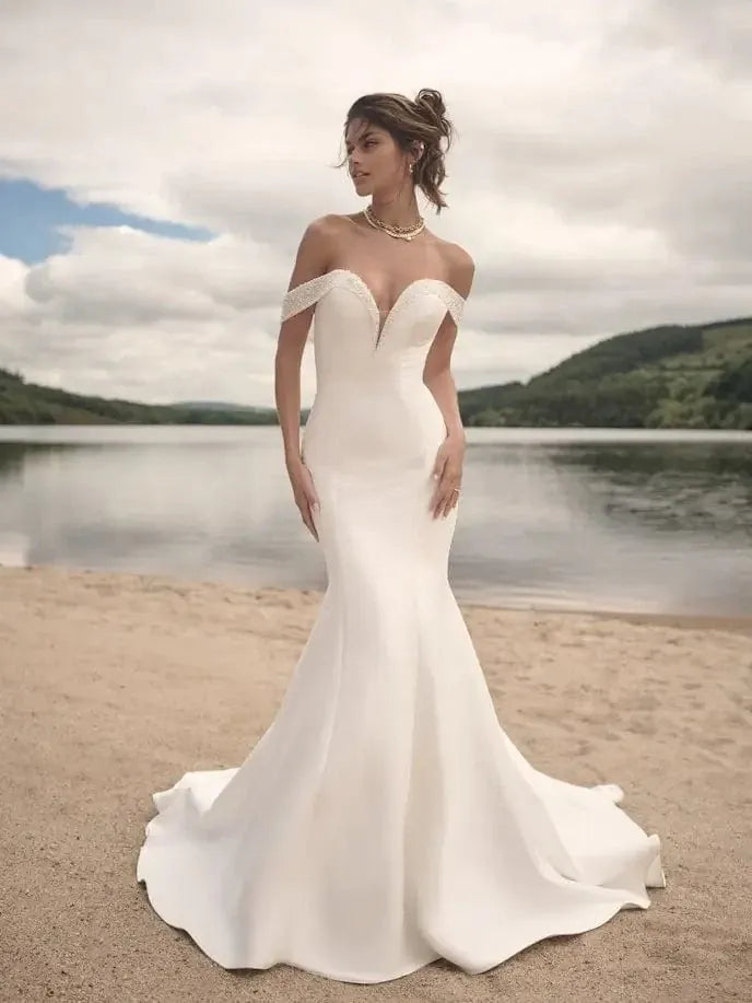 front of sottero and midgley fabienne ivory satin fitted wedding dress with beaded sweetheart neckline and off the shoulder straps