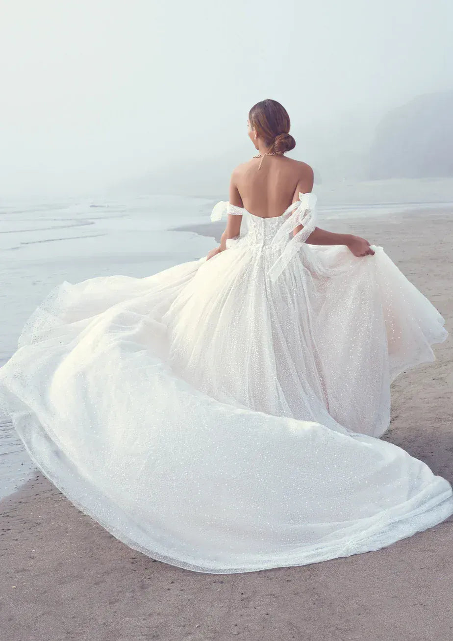 full back of sottero and midgley shasta tulle ball gown with a strapless sweetheart neckline and beading throughout