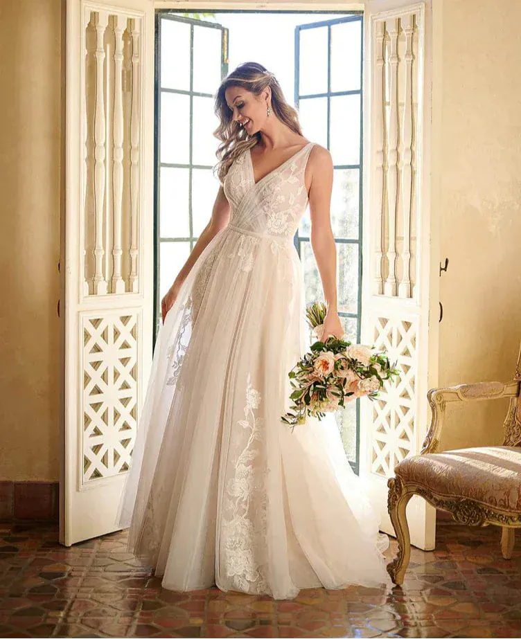 full front of stella york 7126 moscato tulle a-line wedding dress featuring a v neckline and scattered floral appliques