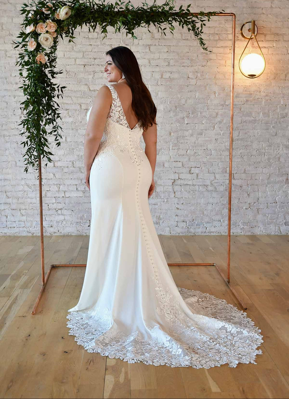 back of stella york 7335 ivory crepe fitted wedding dress, showing the full back with the lace train
