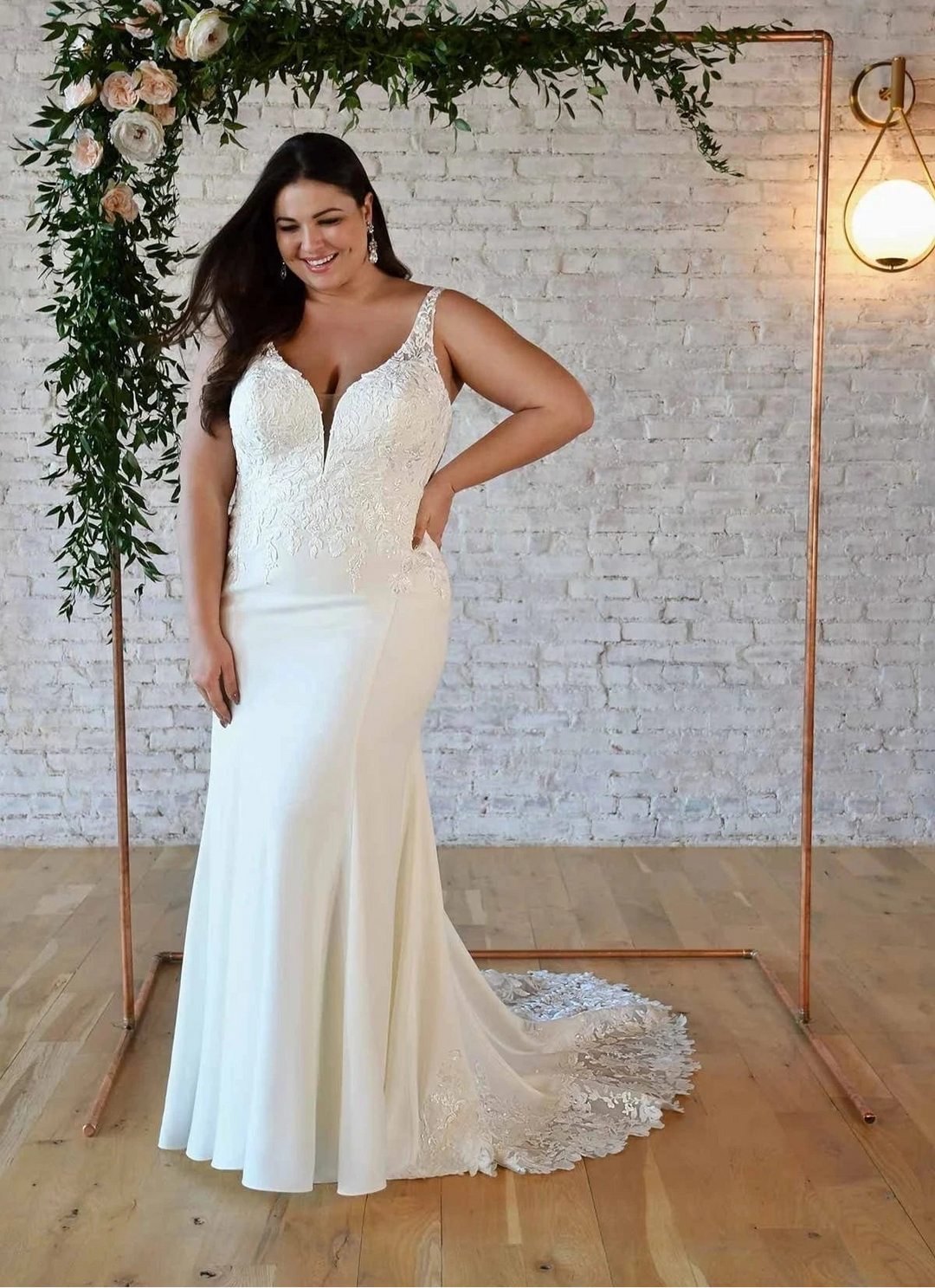 front of stella york 7335 ivory crepe fitted wedding dress, showing the full front with v neck bodice with lace details, and fitted skirt