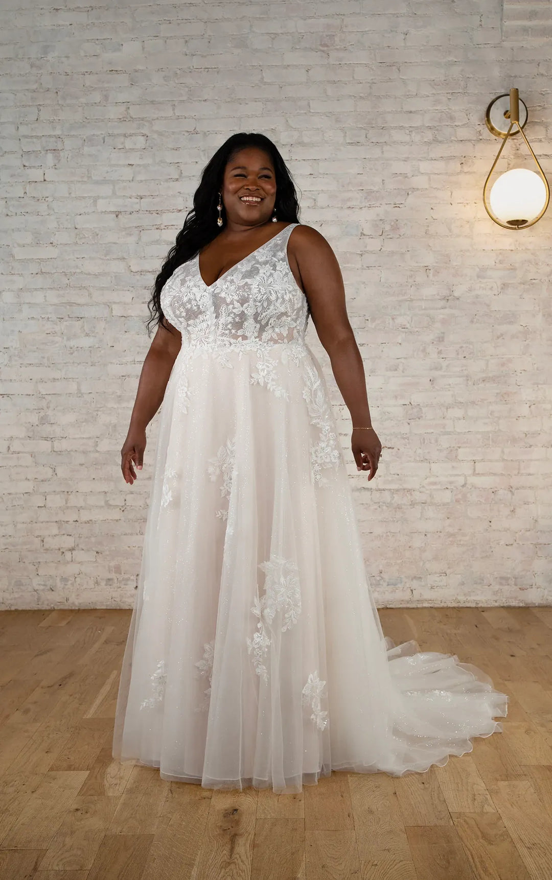 full front of stella york 7794 nude tulle a-line wedding dress with scattered floral lace and a v neckline