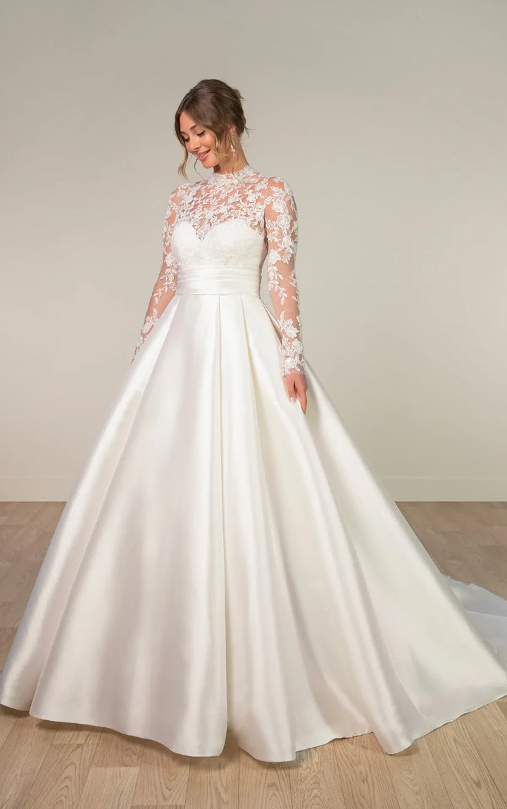 full front of stella york 8230 ivory mikado a-line wedding dress featuring a sheer lace bodice with a high neckline and long sleeves