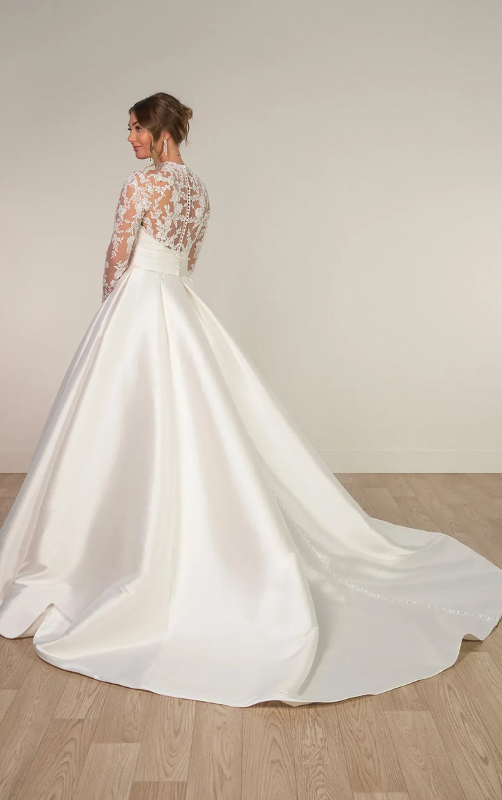 full back of stella york 8230 ivory mikado a-line wedding dress featuring a sheer lace bodice with a high neckline and long sleeves, and a chapel length train