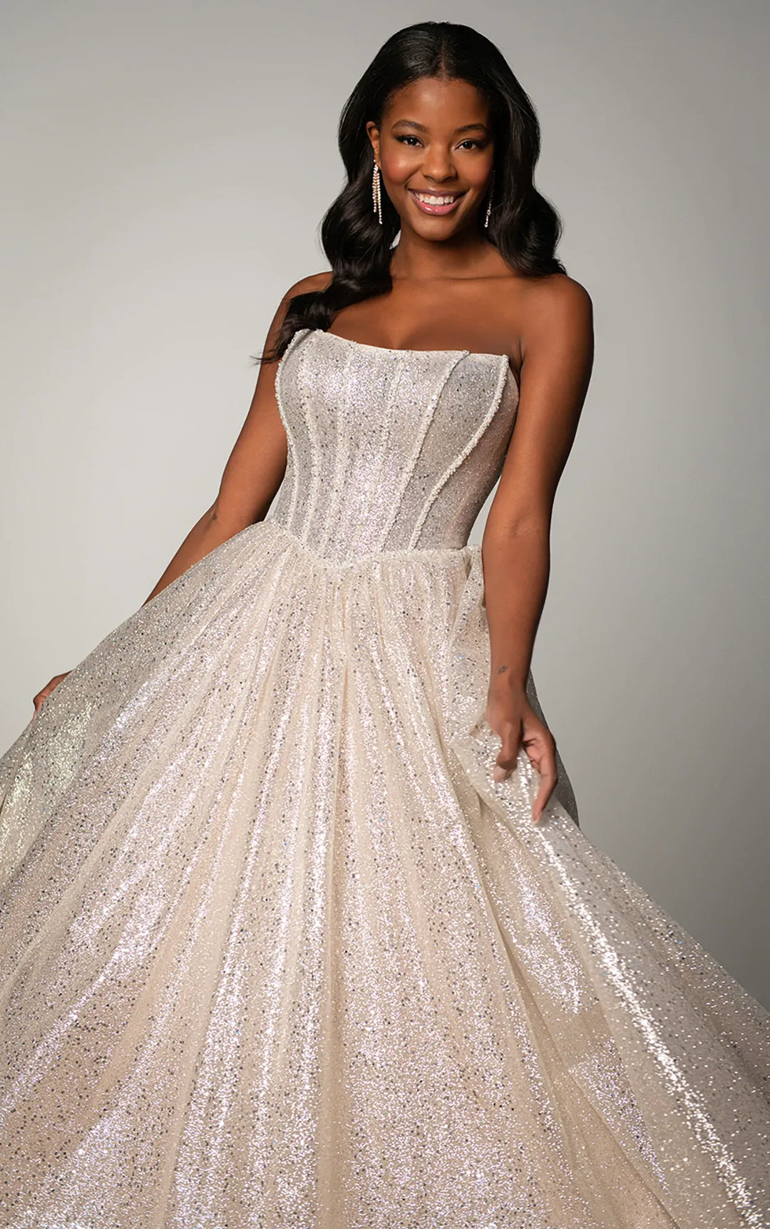 close up of stella york sy8133 champagne sequined ball gown wedding dress with a basque waist and strapless scoop neckline