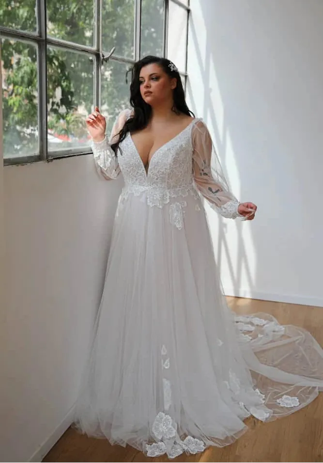 full front of studio levana tulle ivory a-line wedding dress with a v neckline and scattered lace appliques