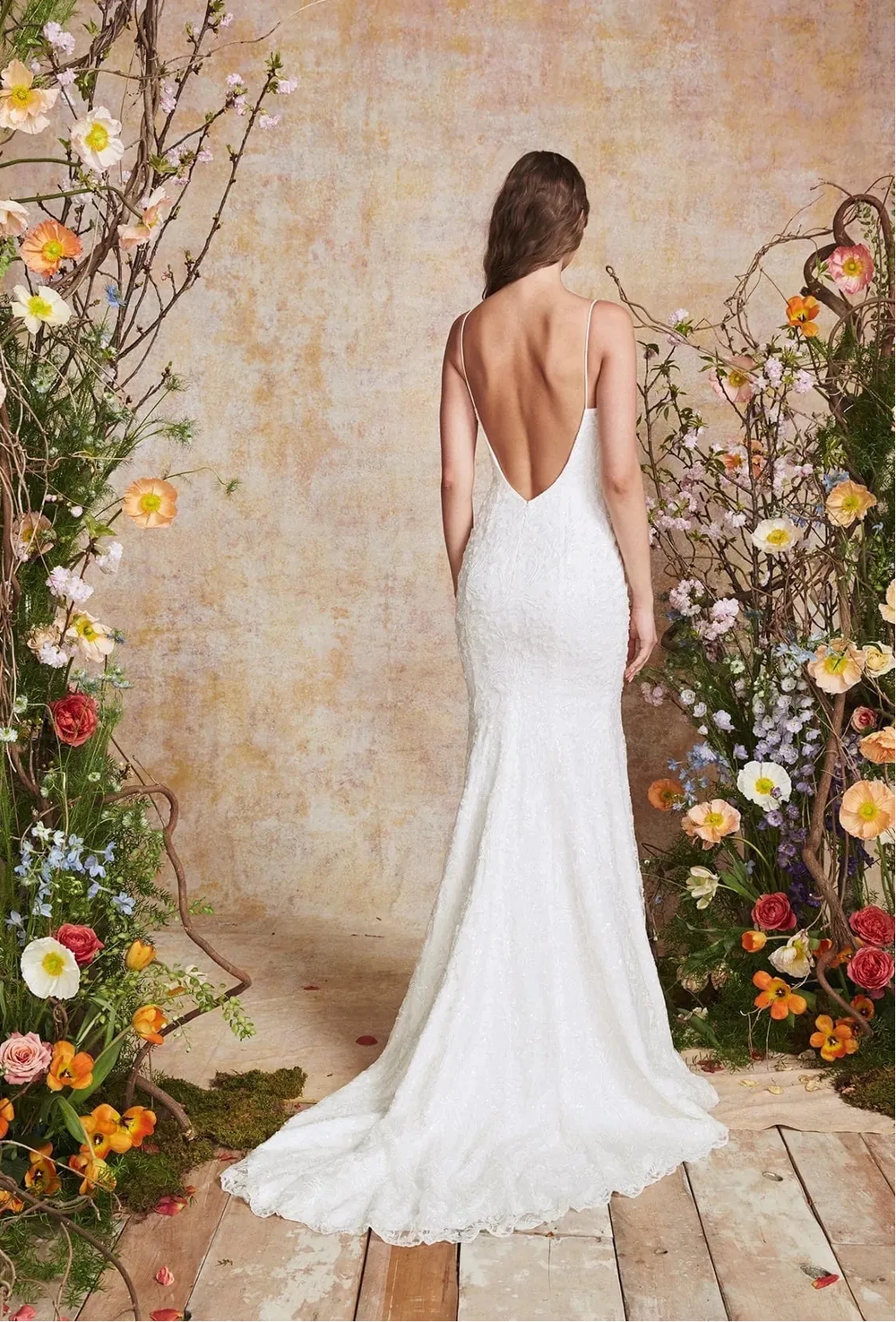 full back of theia cerulean ivory beaded sheath wedding dress with a deep open back