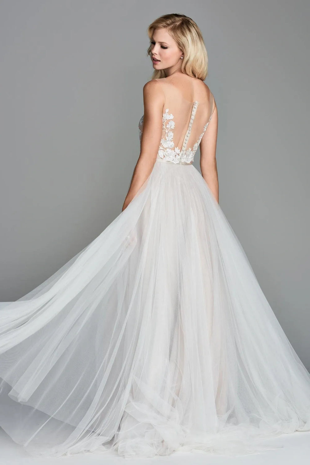back of locket by watters juno latte colored tulle a-line wedding dress, showing the sheer back and short train
