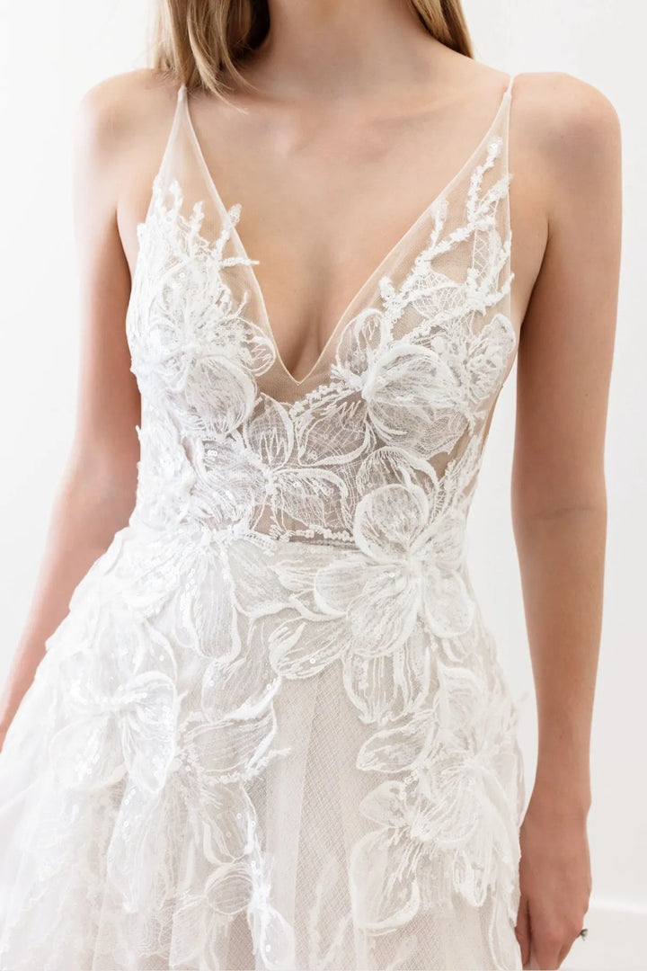 White lace dress with floral details on a white background