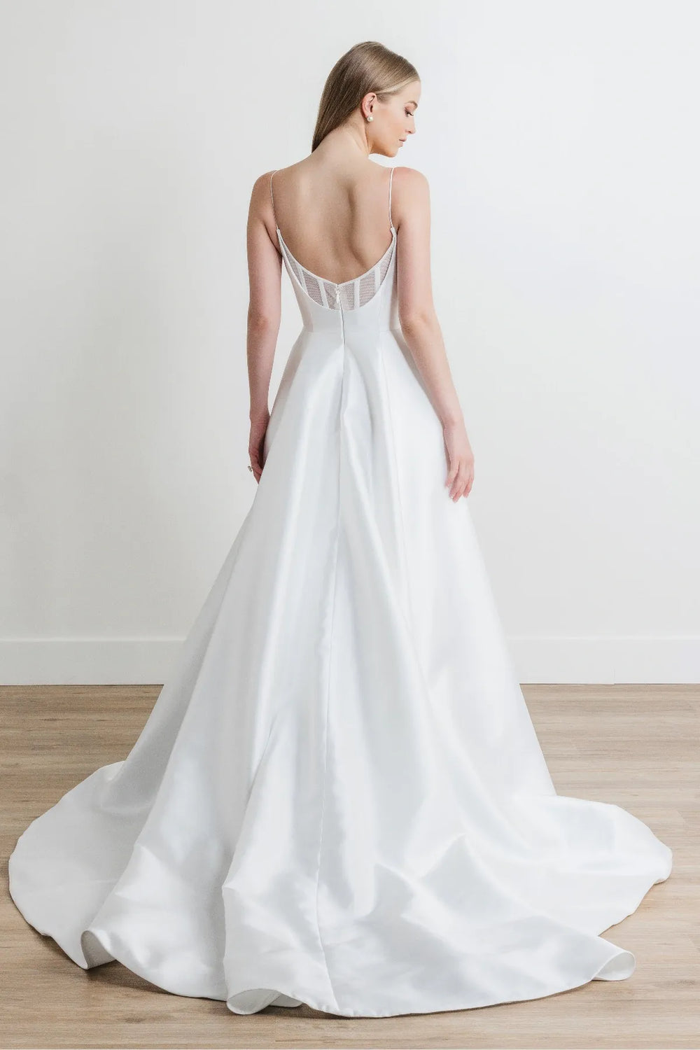 full back of watters hughes ivory mikado a-line wedding dress featuring a sheer back with a short train