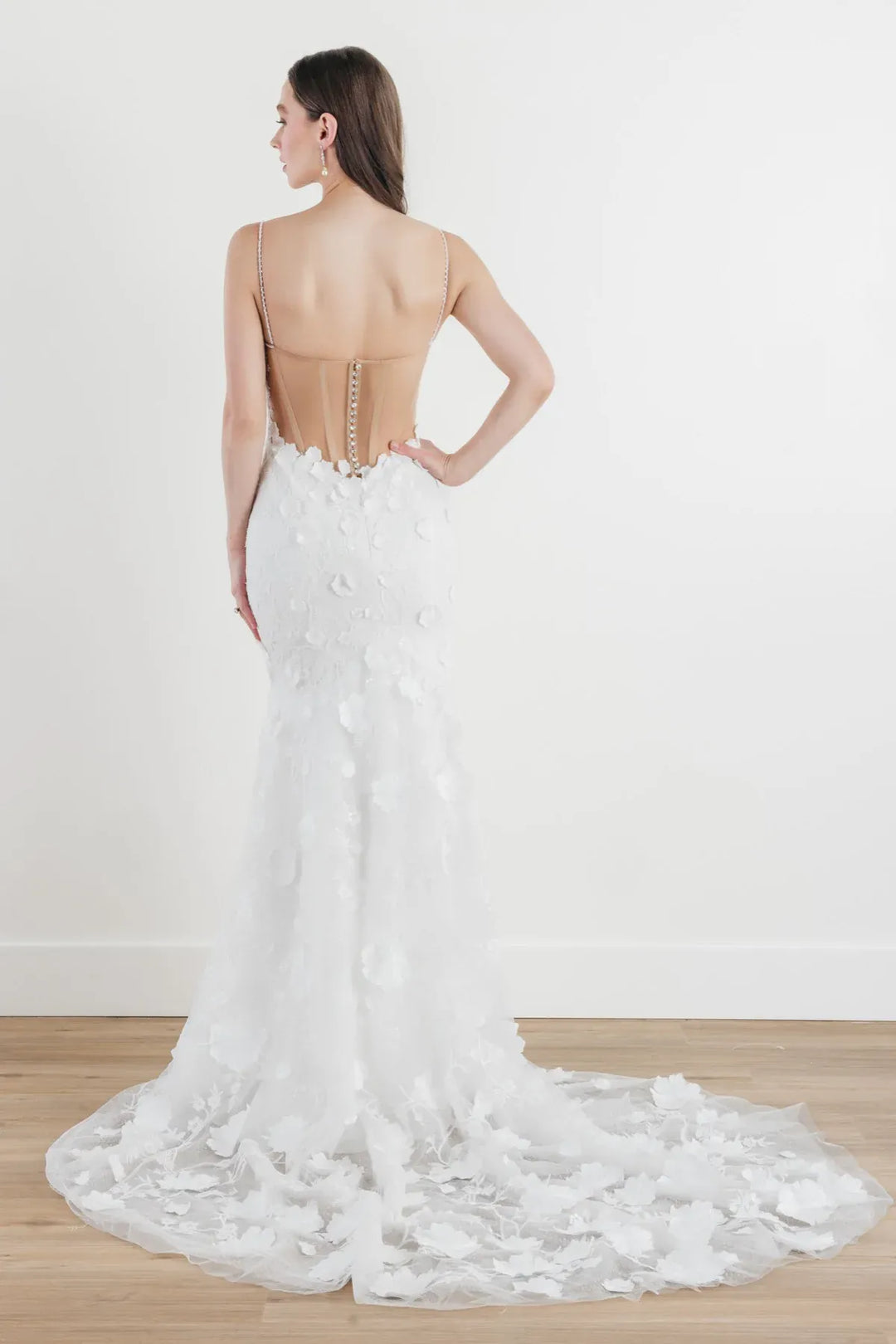front of locket by watters ilsa ivory tulle fitted wedding dress with dimensional floral accents and a sheer back