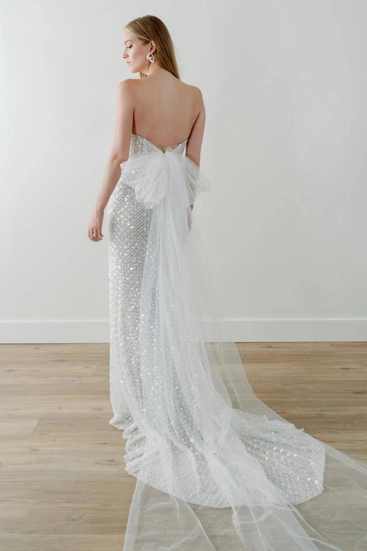 back of watters ondrea ivory beaded fitted wedding dress, showing the full back with a tulle bow at the back