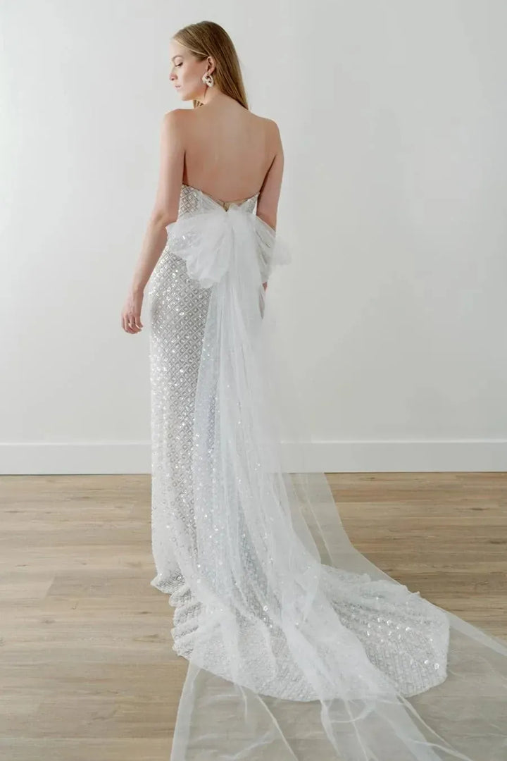 full back of watters ondrea champagne beaded fitted wedding dress featuring the tulle bow at the back and short train
