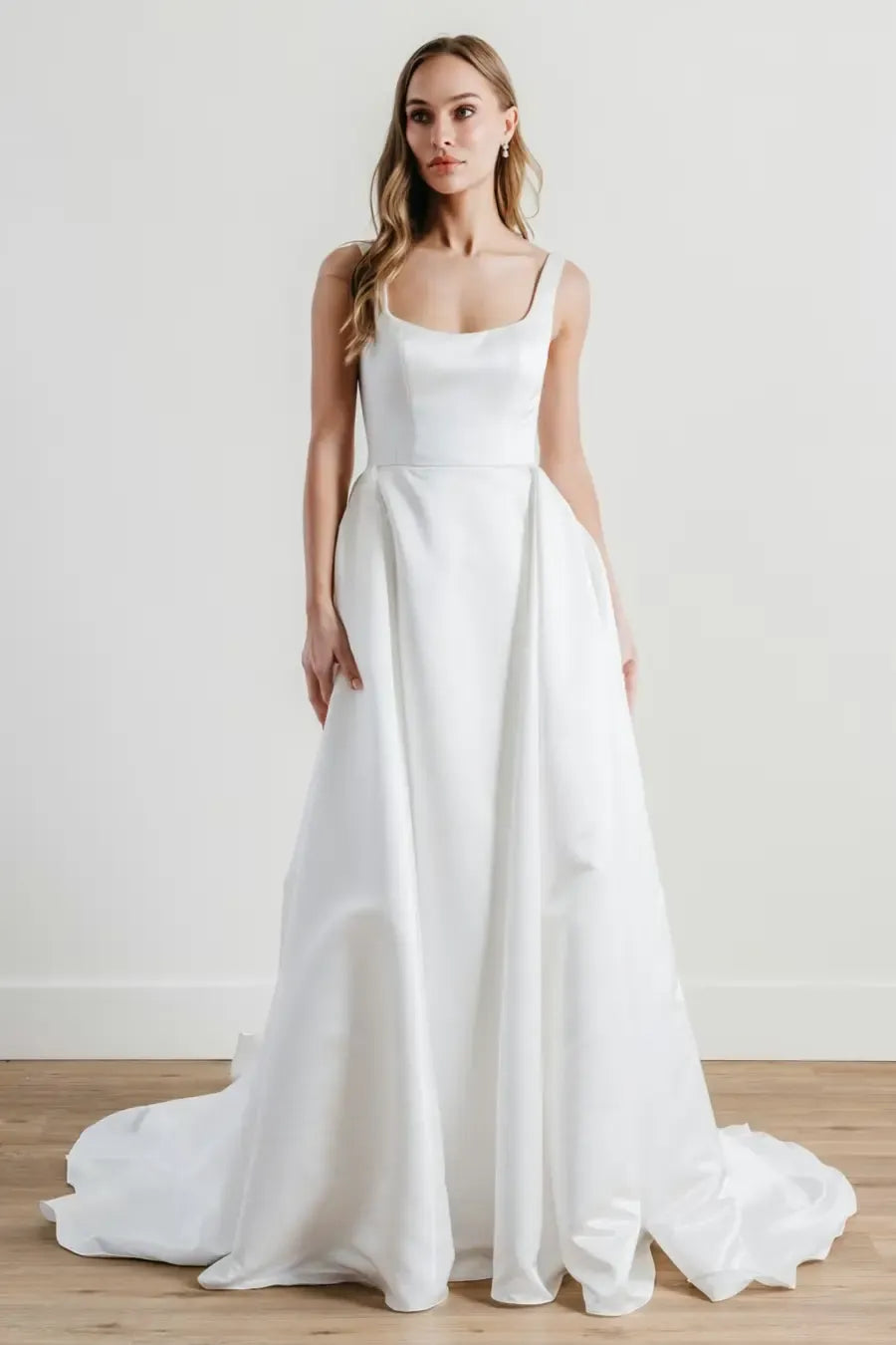 full front of locket by watters paketti ivory satin wedding dress with a square neckline and pockets in the skirt