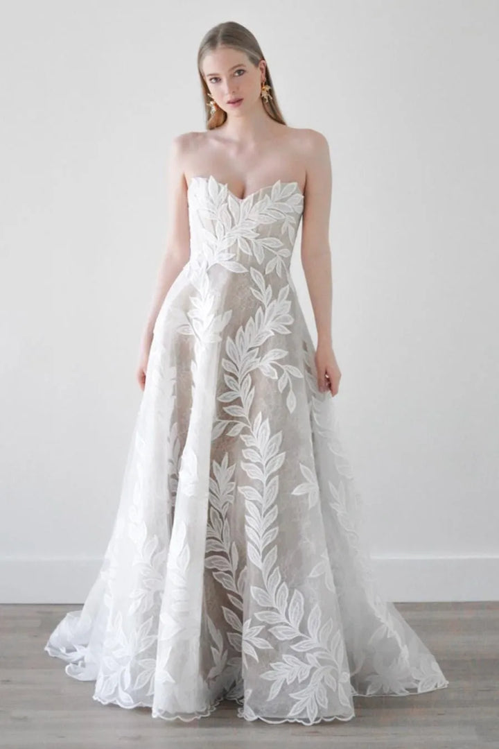 full front of watters soraya ivory tulle a-line wedding dress featuring a strapless sweetheart neckline and oversized floral print